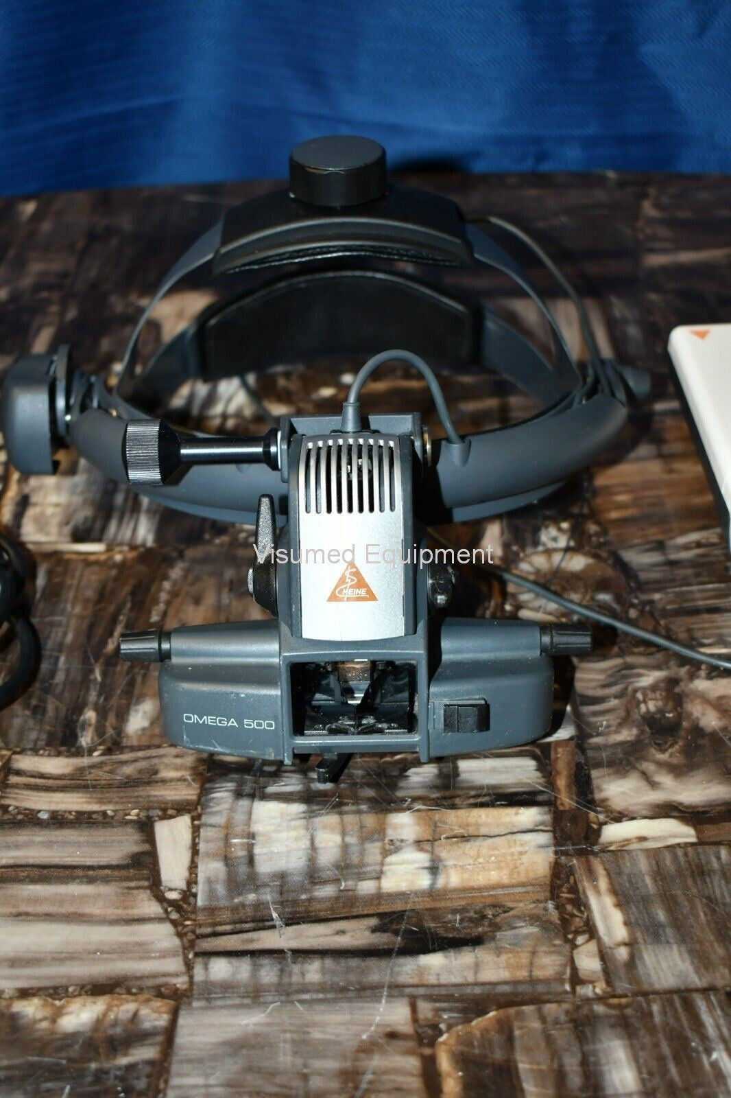 Refurbished Heine Omega 500 Binocular Indirect Ophthalmoscope with rechargeable mPack offered by Visumed Equipment