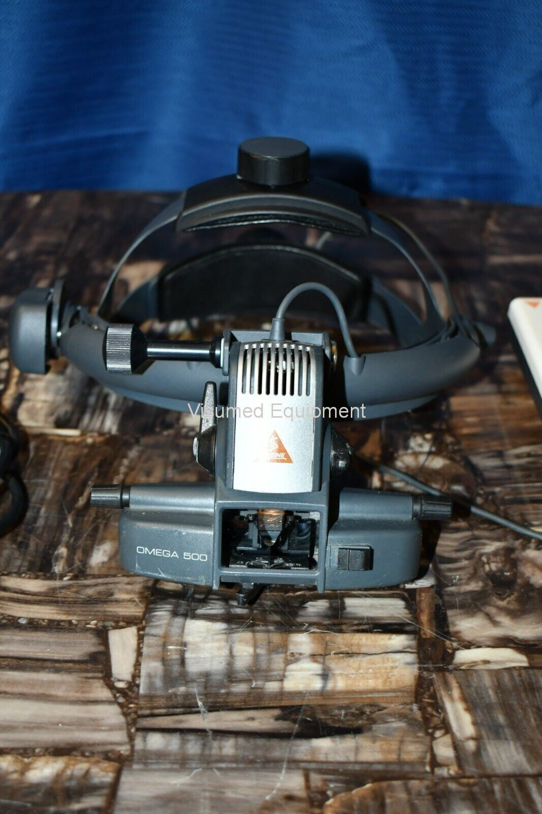 Refurbished Heine Omega 500 Binocular Indirect Ophthalmoscope with rechargeable mPack offered by Visumed Equipment