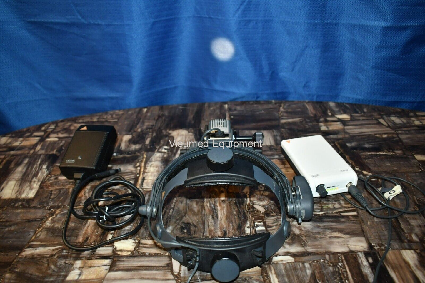 Refurbished Heine Omega 500 Binocular Indirect Ophthalmoscope with rechargeable mPack offered by Visumed Equipment