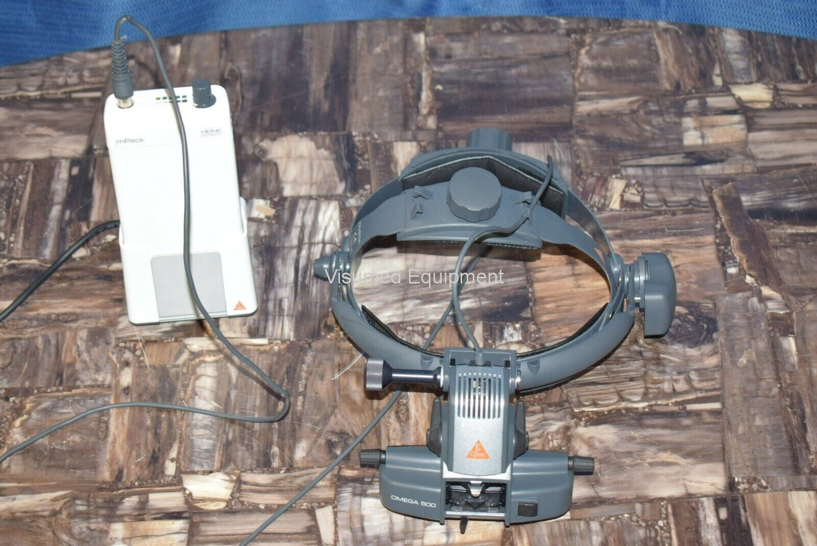 Refurbished Heine Omega 500 Binocular Indirect Ophthalmoscope with rechargeable mPack offered by Visumed Equipment