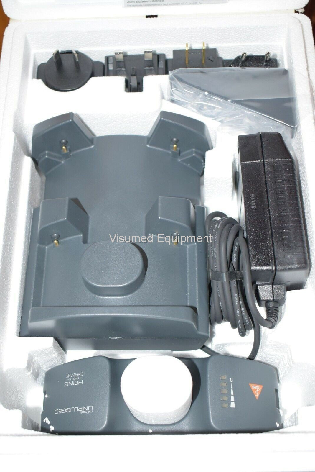 Refurbished Heine Omega 500 Unplugged Indirect Ophthalmoscope & New Battery and wall charger offered by Visumed Equipment