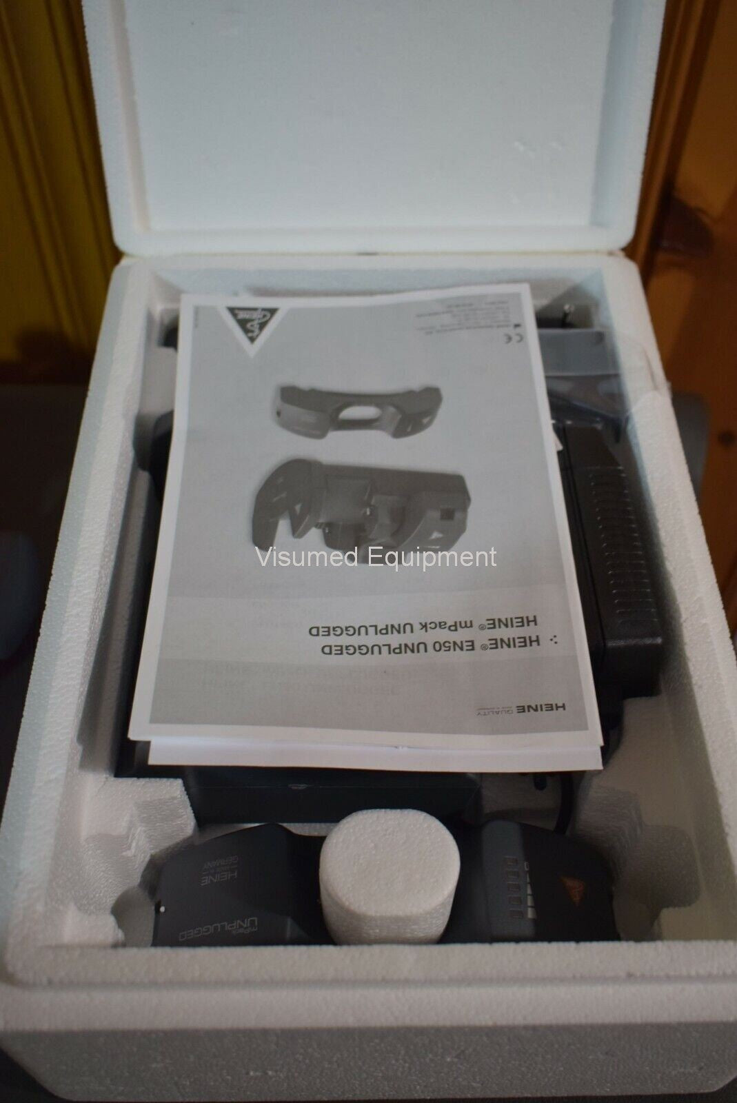 Refurbished Heine Omega 500 Unplugged Indirect Ophthalmoscope & New Battery and wall charger offered by Visumed Equipment