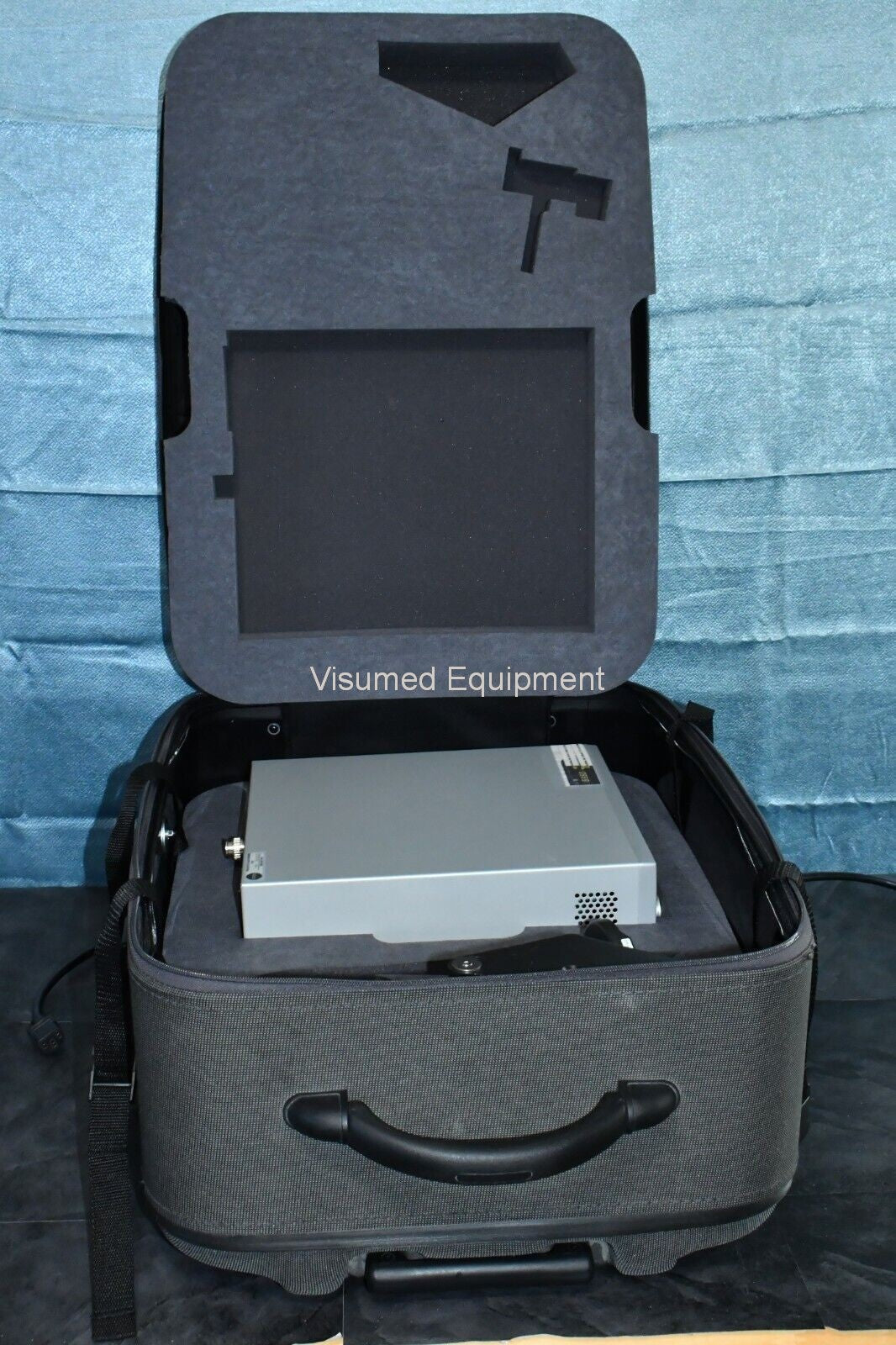 Refurbished Ellex Solitaire Green laser with Haag Streit Adapter and storage case offered by Visumed Equipment